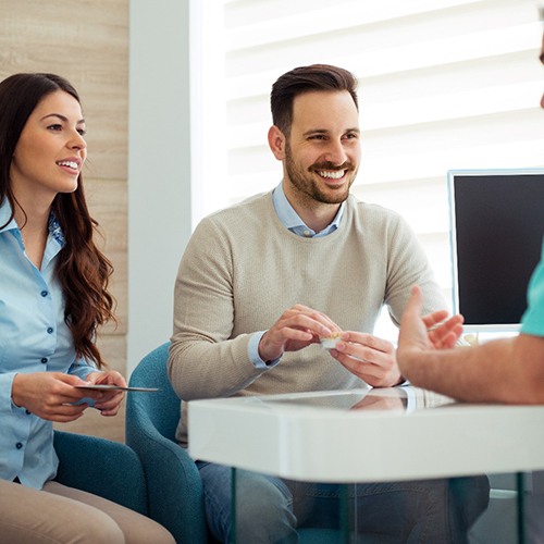 Couple consults with dentist